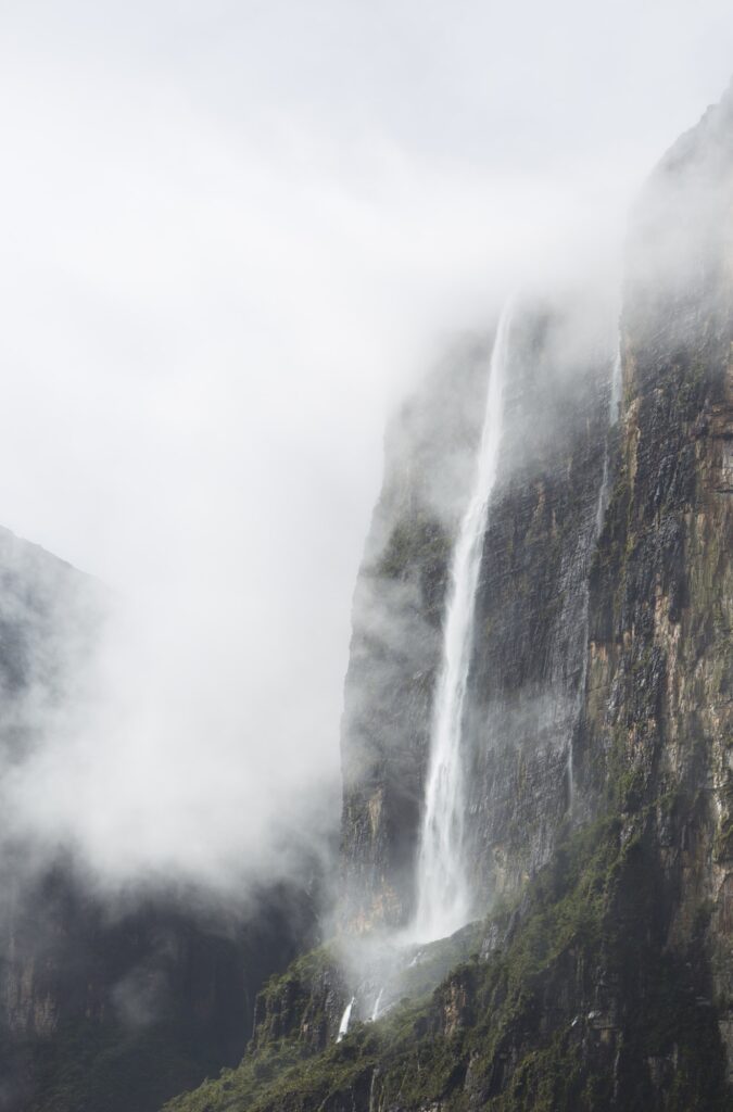 Waterfalls and clouds at Kukenan tepui or Mount Roraima. Venezue